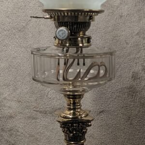 Hinks No 2 burner on a Hinks Corinthinan Column base with a Young's clear bevel cut reservoir and and etched clear globe shade