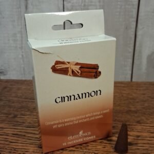 Package that is brown, black and white with image of cinnamon sticks and also an actual cone