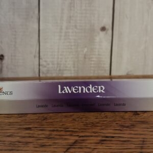 A tube of incense stick with packaging in white, lavendar and black with picture of lavendar