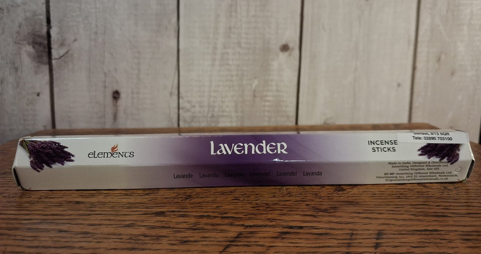 Elements Lavender Incense Sticks 1 A tube of incense stick with packaging in white, lavendar and black with picture of lavendar