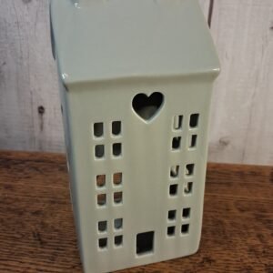 A chic and simple grey toned house with only an added heart cut decal and T-light holder option. Made from ceramic