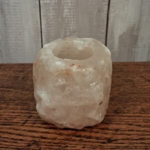 Himalayan rock salt tea light holder. Rough cut exterior and has a dusky rose colour