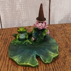 A incense cone backflow burner features a frog perched on a lily pad