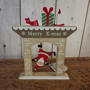 Fireplace with mantle showing Santa falling head first into fireplace. Wood and painted red, grean, white and buff colour