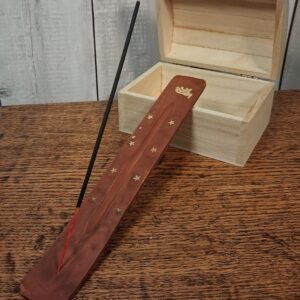 Wooden ash catchers accented with small gold stars and an elephant