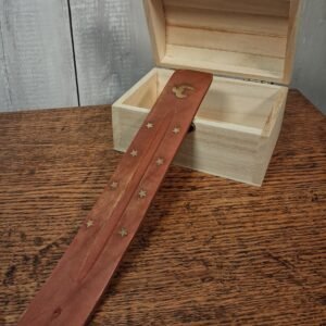 Wooden ash catchers accented with small gold stars and an Om
